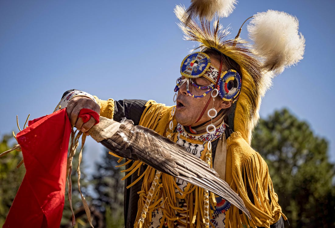 Free Man in Gold and Red Costume Stock Photo