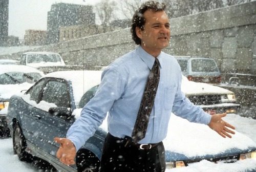 Bill Murray as Phil Connors sardonic weatherman trapped in a time loop on Groundhog Day