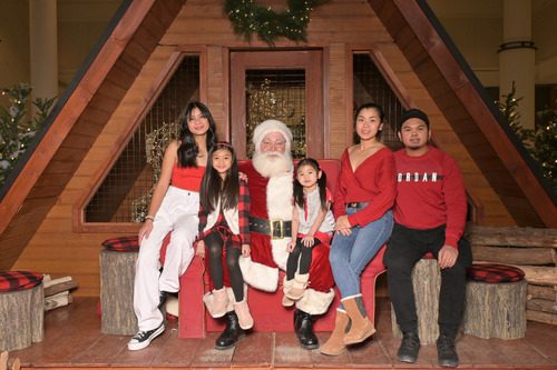 Ryan and family with Santa Claus at Christmas