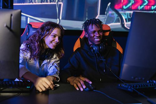 Man and woman enjoying a co-op video game