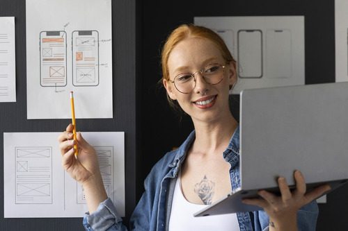 Girl showing design for mobile app for Mobile App Development Courses