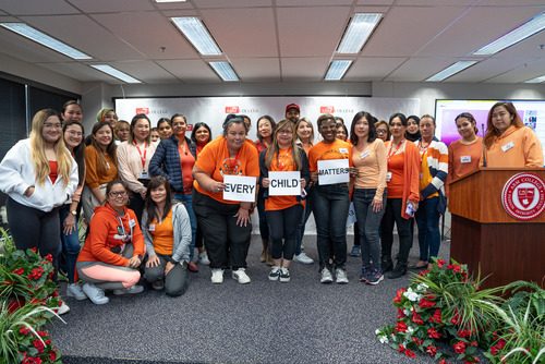 Team ABM College wearing orange tshirts 