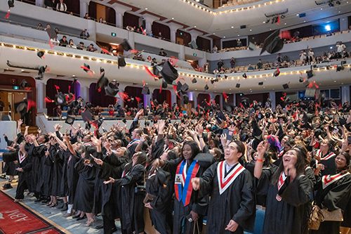 340 graduates celebrate with a traditional hat toss to commemorate the occasion and get a great picture 