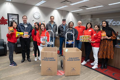 ABM Food Drive for October 2023 staff presents food for donation