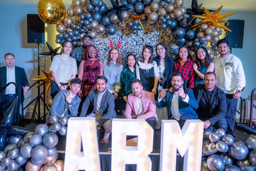 ABM Staff while posing for holiday party