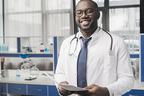 A friendly doctor reviewing promising test results with a patient