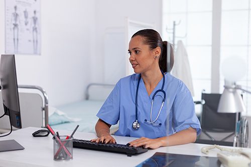 A medical office administrator updates a patient's records