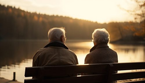 Two seniors enjoying the tranquility of the lake