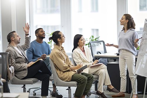 A group of practicum students attending a company orientation