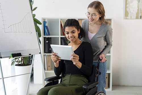 A PSW spends quality time with her young wheelchair-bound patient