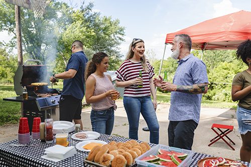 Victoria Day gathering around the barbeque with lots of food for everyone to enjoy