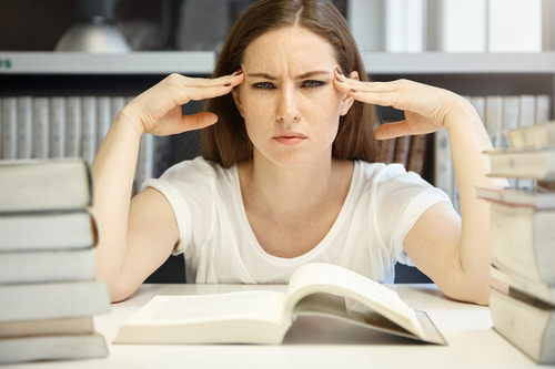 Girl with her hand on head showing she is stressed