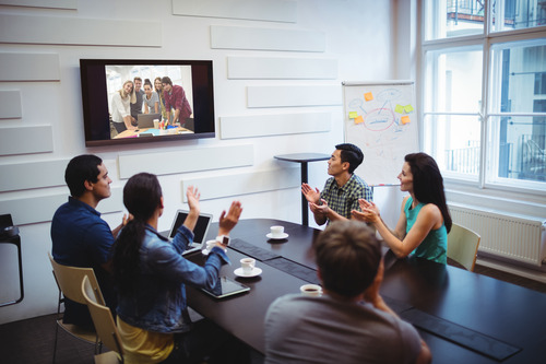 two teams seen having a virtual event at different cities