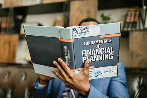 Financial Planner Student reading about the Fundamentals of Financial Planning