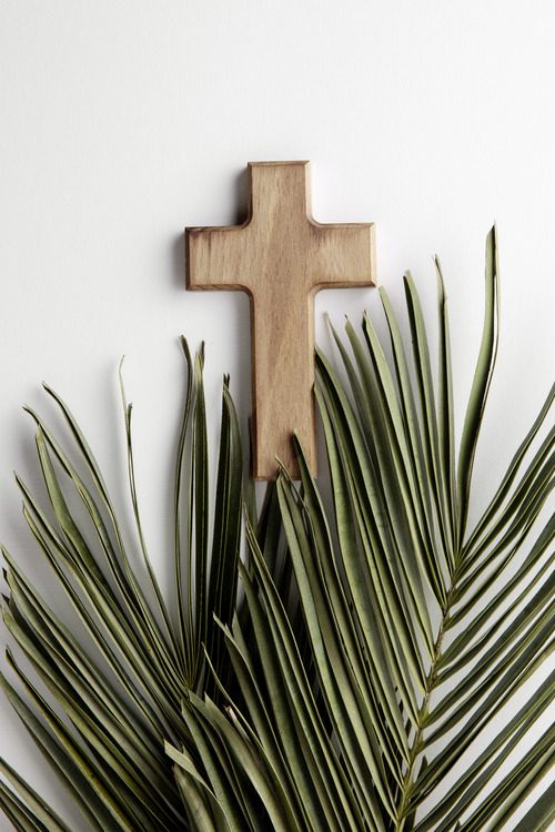 image showing  green leaves and cross arrangement