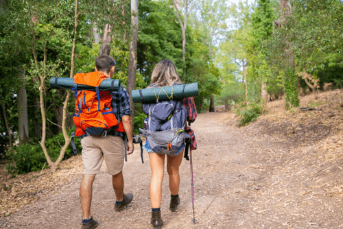 Man and Woman doing hiking in a perfect weather 