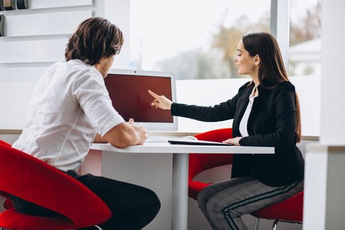 Young boy while consulting a professional from Employment services 