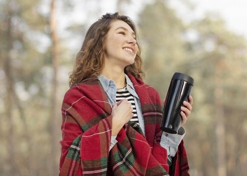  Young college girl holding a tumbler 